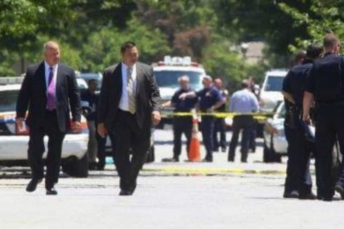 owner, partner, and other law enforcement professionals at a crime scene